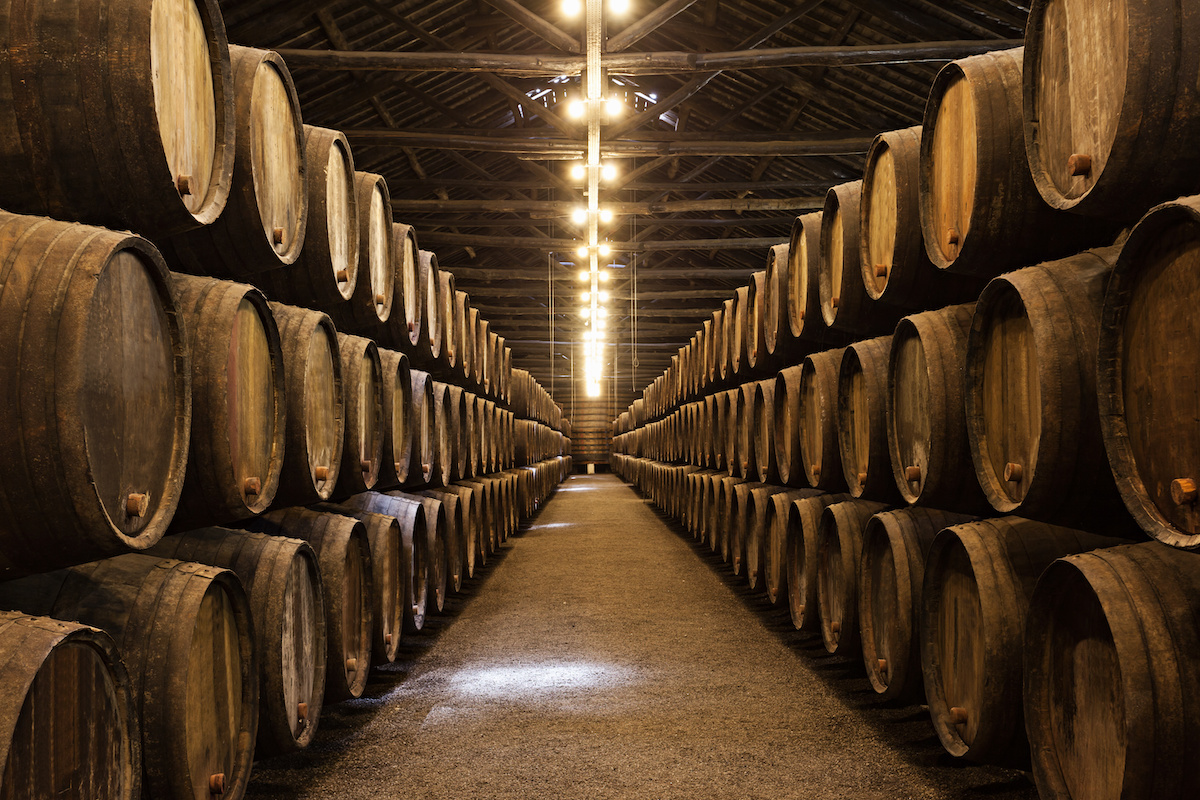 Barrels stacked in a dark cellar